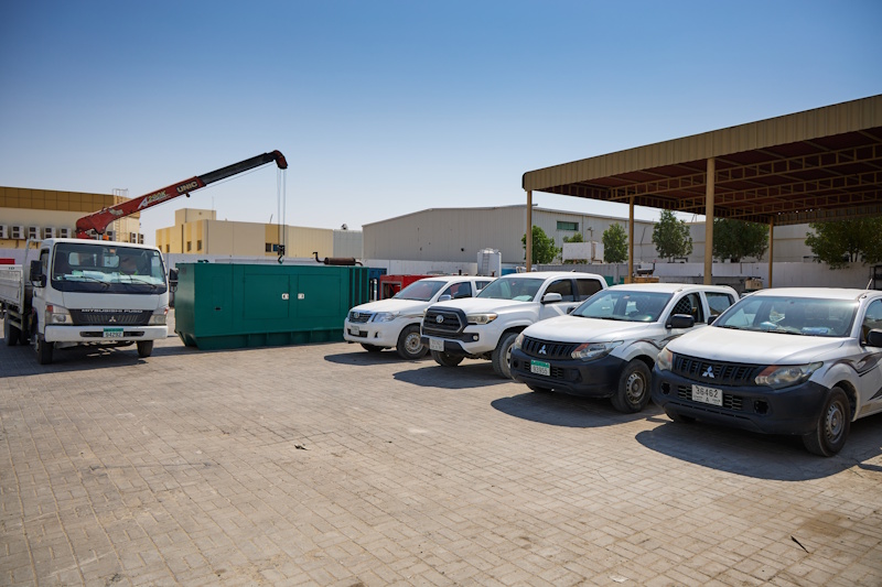 Mobile UNIC boom crane truck and service pickups in Al Tamam yard